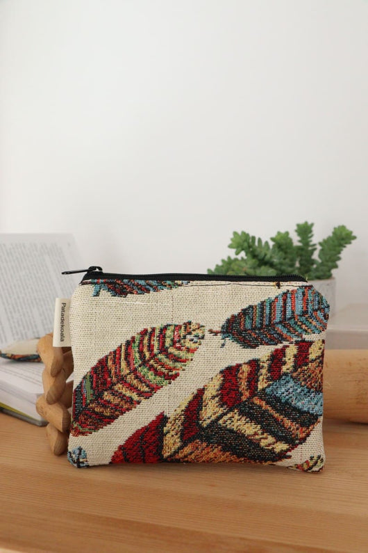 monedero plumas unisex